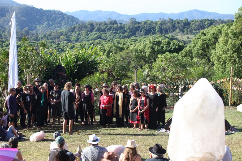 The choir gathering to sing at the Crystal Castle 