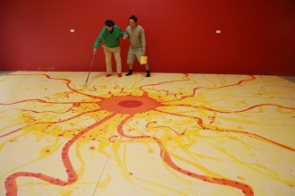 John Olsen working on his massive King Sun painting.