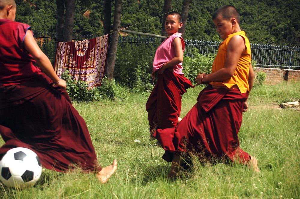 The Tibetan Buddhist nuns enjoying a game of soccer.