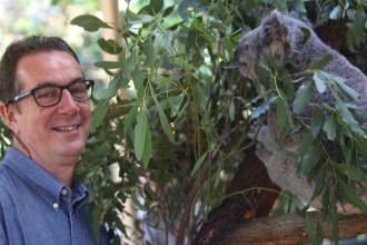 Tony Gilding and 'River' getting acquainted at the Macadamia Castle's new koala sanctuary.
