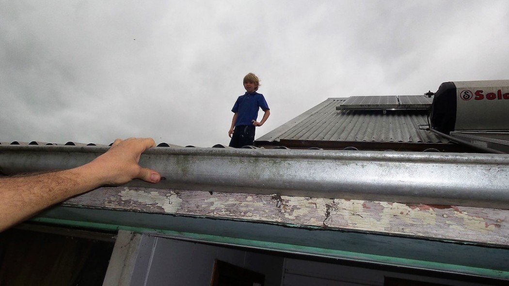 Rescuing a young boy from his roof in Alexandra Parade, Lismore.  Photo: Melissa Gulbin