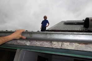 Rescuing a young boy from his roof in Alexandra Parade, Lismore.  Photo: Melissa Gulbin