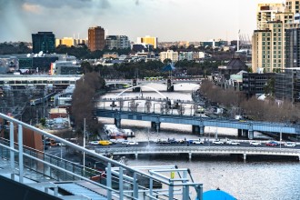 A COMPLEX VIEW OF THE YARRA RIVER, MELBOURNE. COMPRESSED BY A TELEPHOTO LENSE, TAKEN FROM THE 13TH FLOOR OF A FLINDERS STREET APARTMENT.